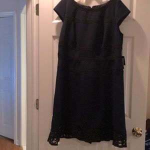 Navy blue cocktail dress with black lace trim